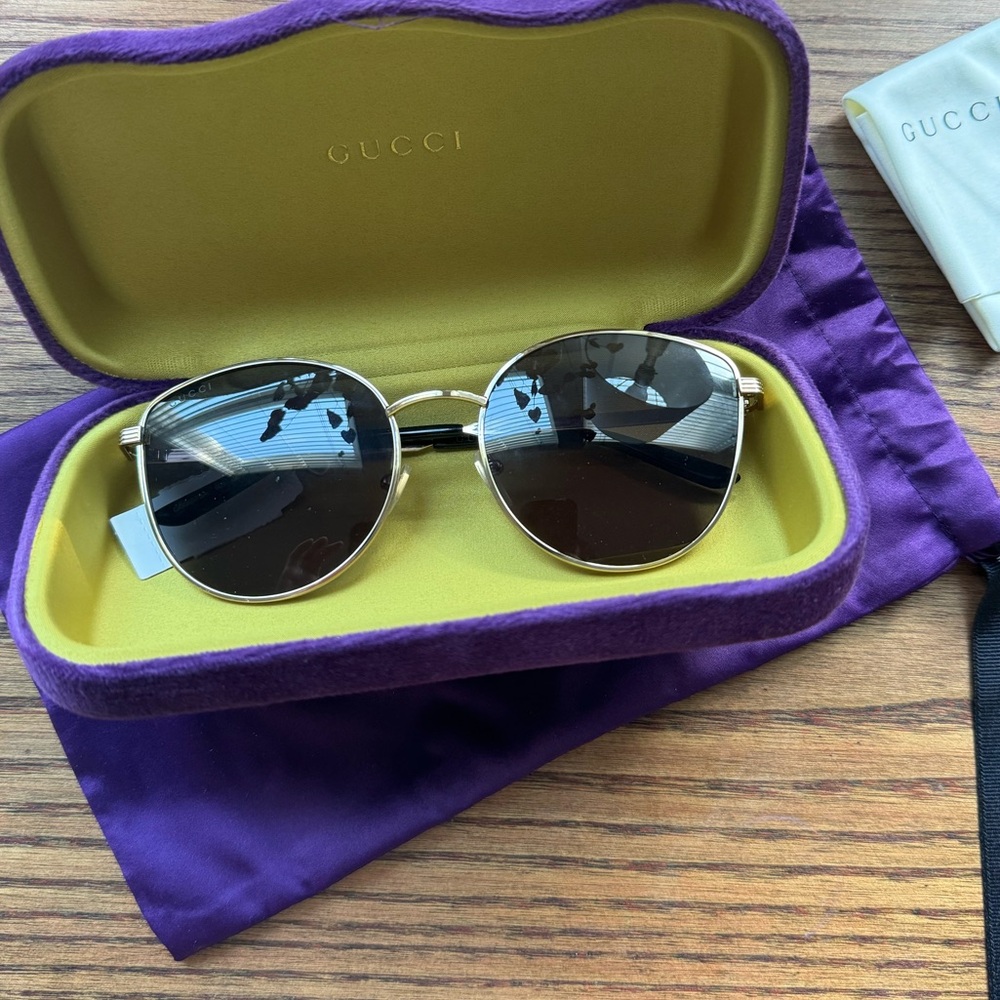 Gucci golden black sunglasses